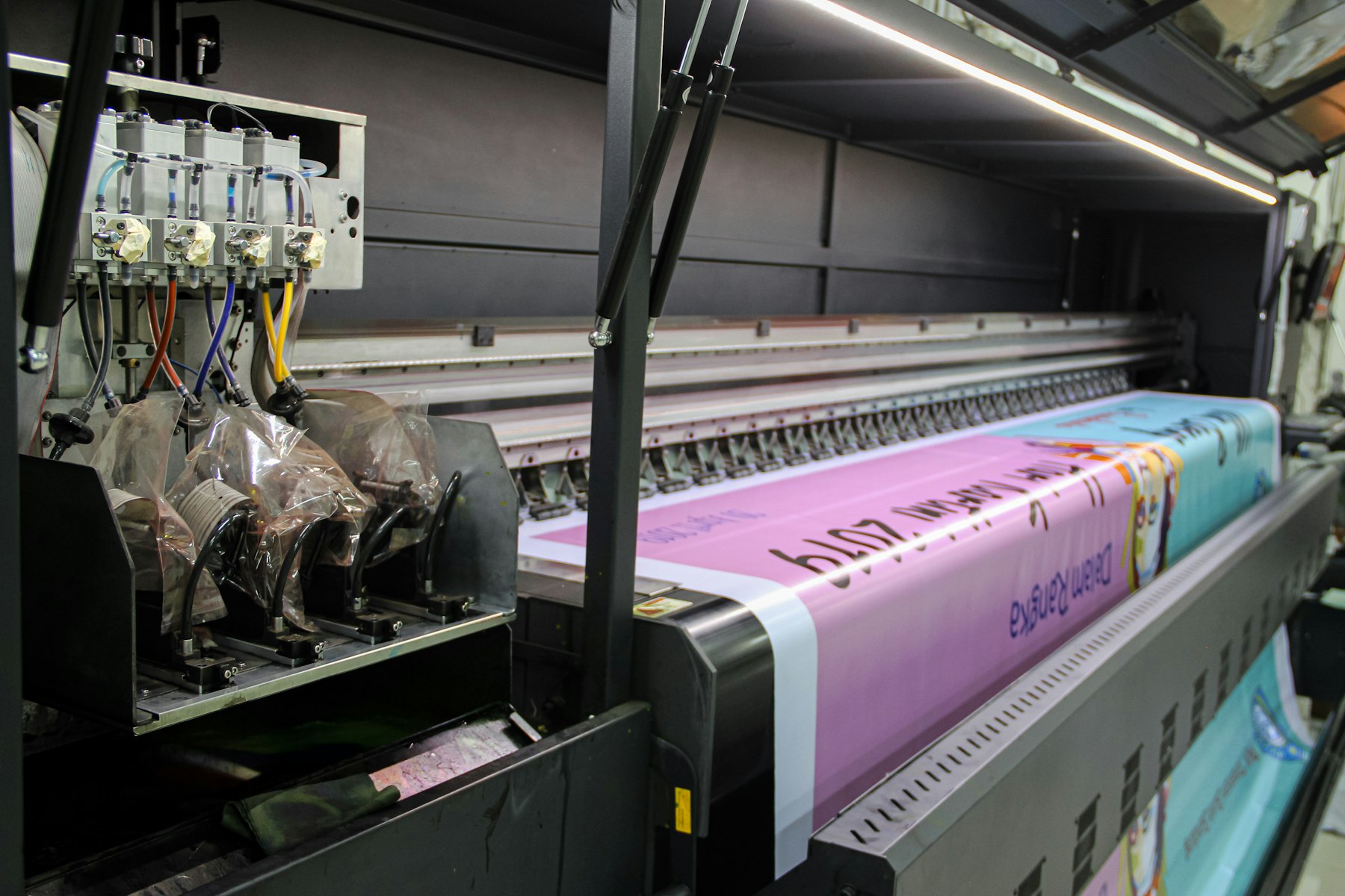 Large format printer running a colour job